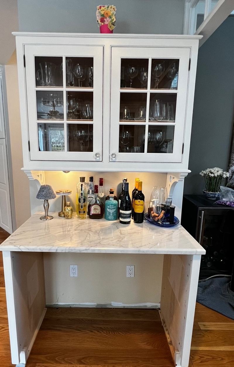 After: the same hutch painted white, with an open space under the counter