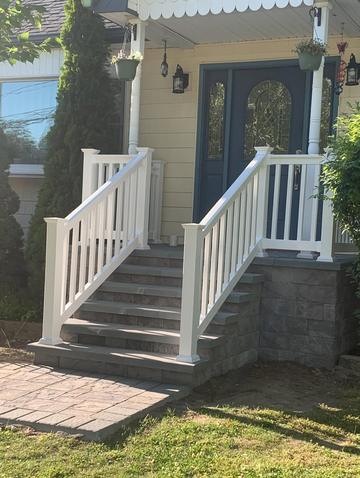 White stair railings on a front stoop, seen from the side